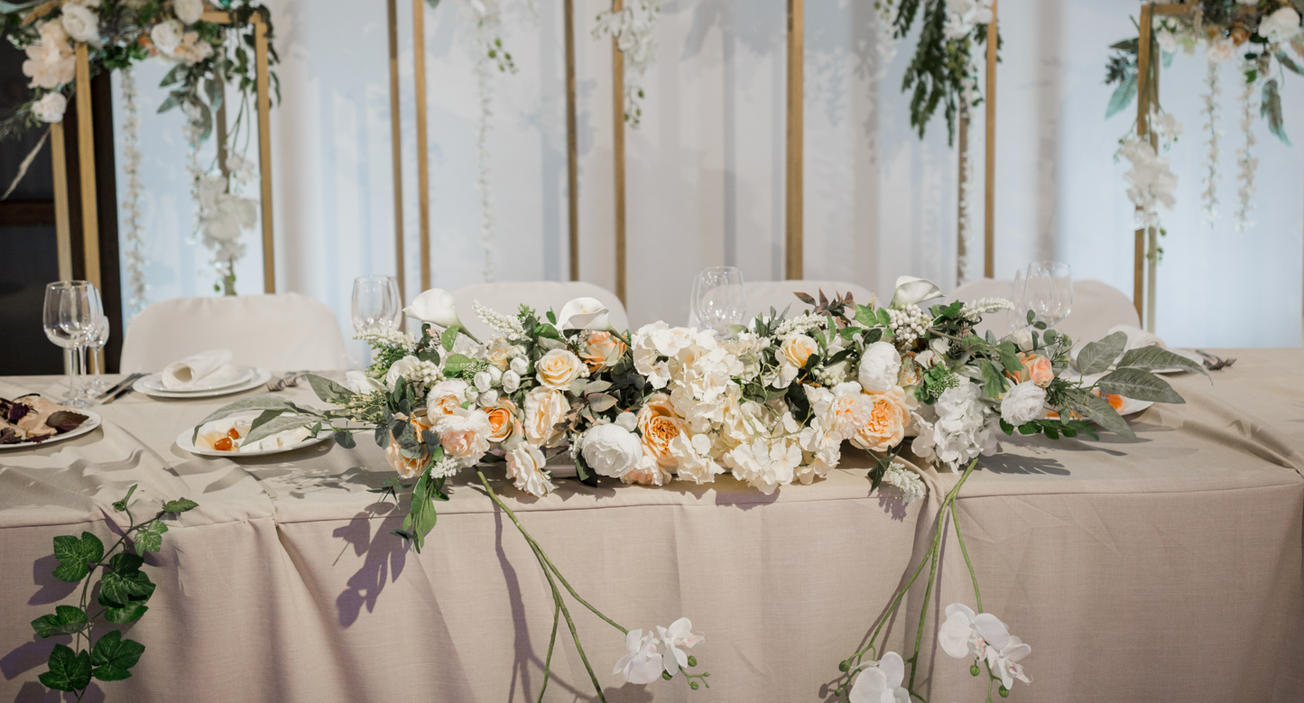 Flowers and candles head table decor